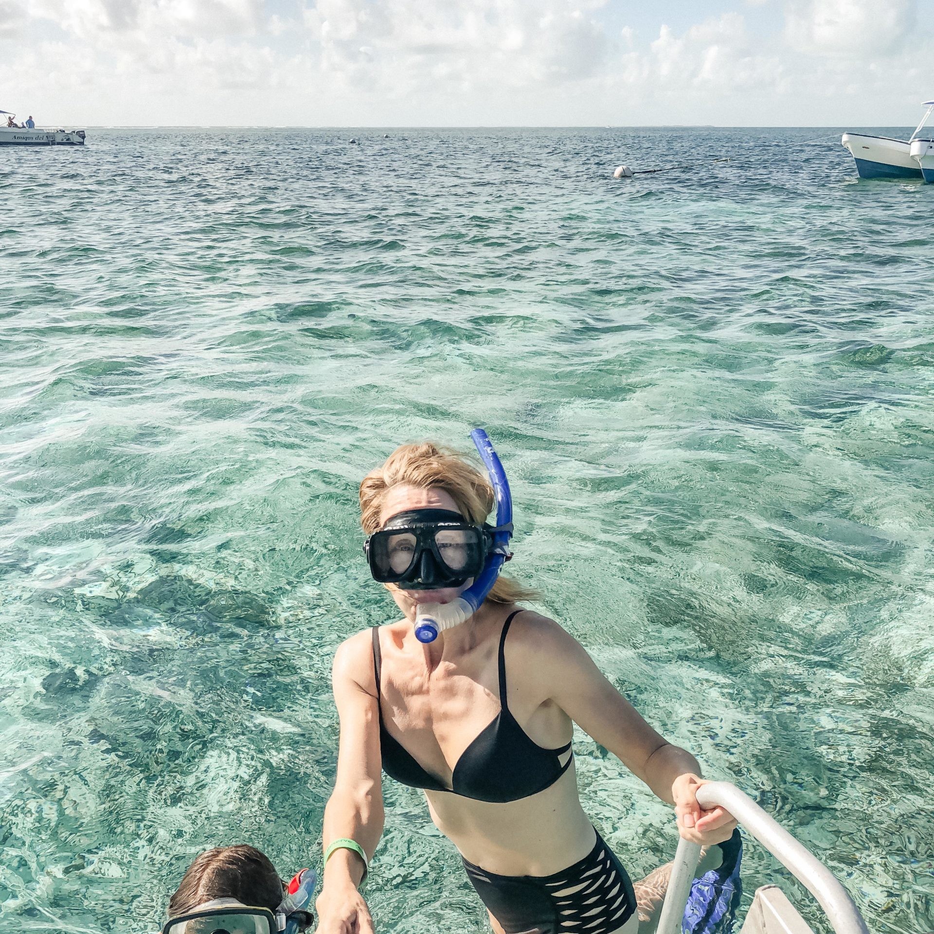 Lisa Breckenridge swimming with family in Belize